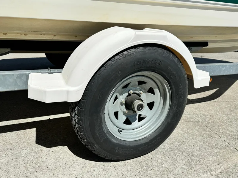 Slide: The Image of Trailer wheel of a 2005 Trophy 1952 Walkaround boat. - 22
