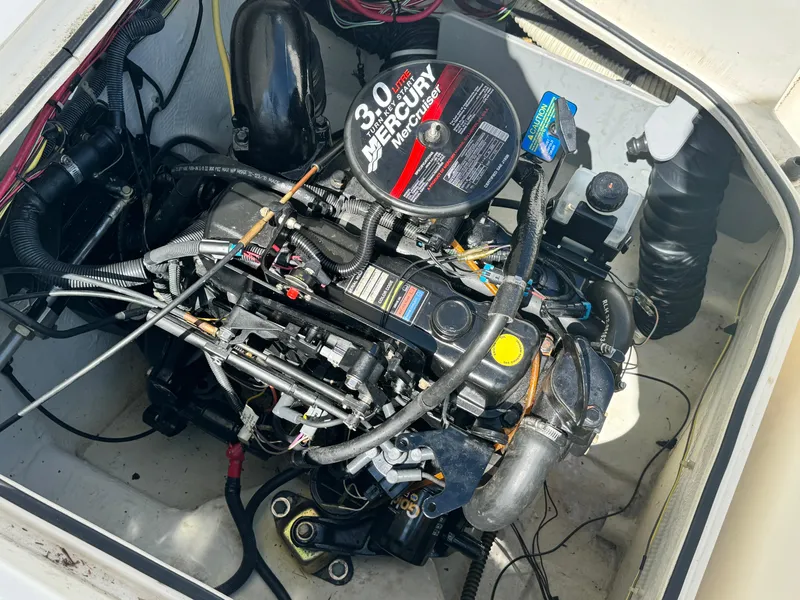 Slide: The Image of Engine compartment of a 2005 Trophy 1952 Walkaround boat with a 3.0L Mercury engine. - 26