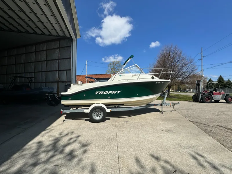 Slide: The Image of 2005 Trophy 1952 Walkaround boat on a trailer outside a storage facility. - 3