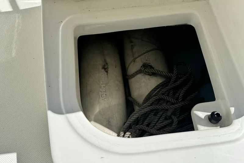 Slide: The Image of Storage compartment on a 2005 Trophy 1952 Walkaround boat with fenders and ropes. - 37