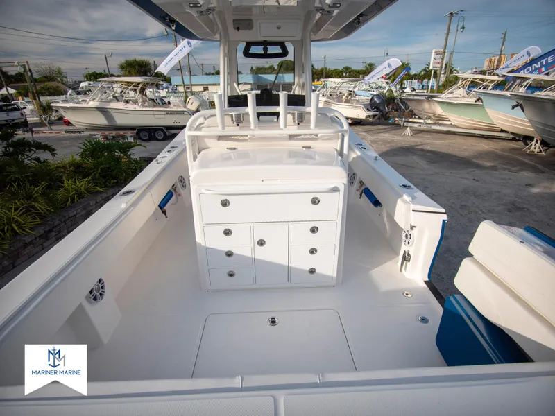 Slide: The Image of 2024 Regulator 31 boat interior with storage compartments and seating. - 11