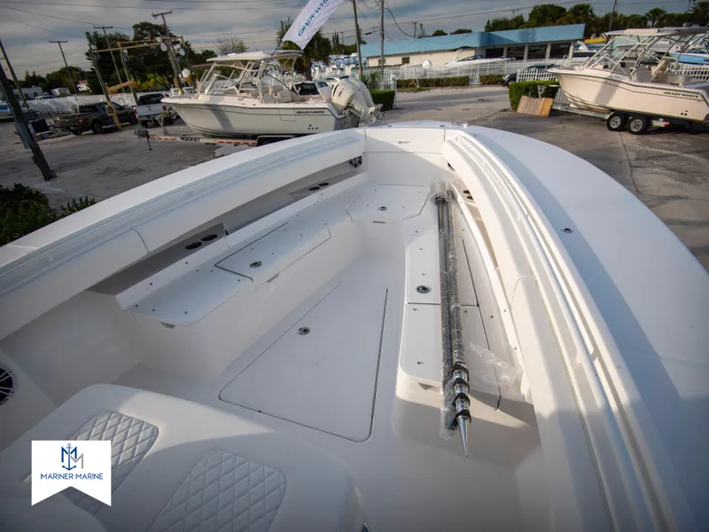 Slide: The Image of 2024 Regulator 31 boat deck with seating and storage compartments. - 13