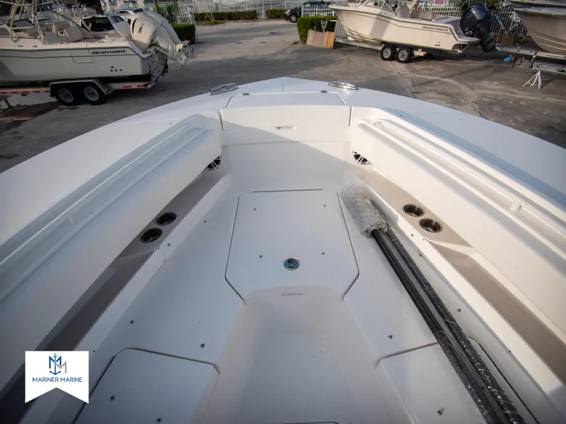 Slide: The Image of 2024 Regulator 31 boat interior, spacious deck with storage compartments. - 14