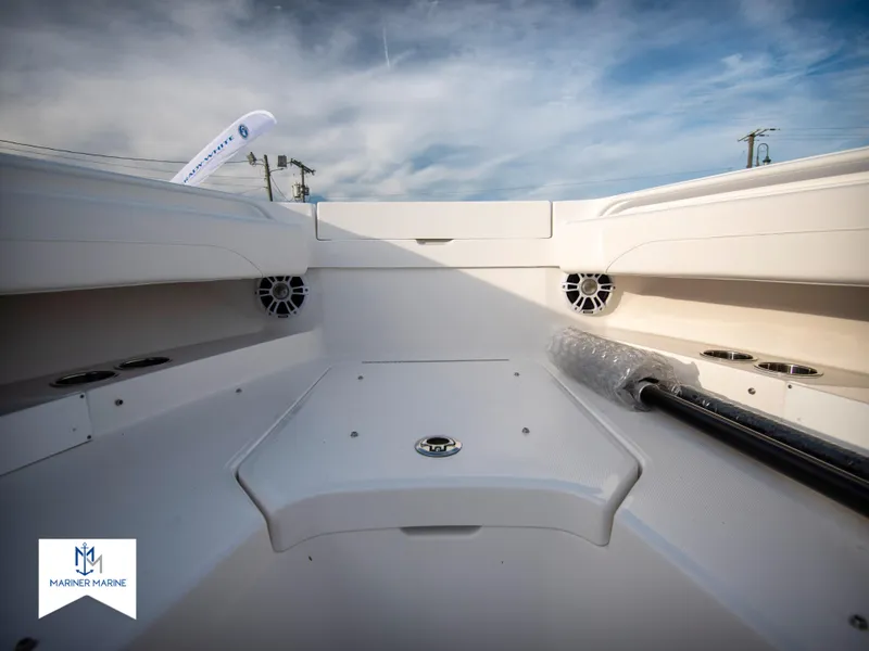 Slide: The Image of 2024 Regulator 31 boat interior with storage compartments and speakers. - 15