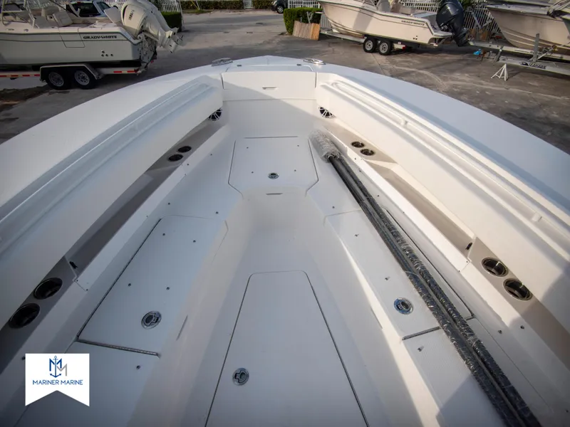 Slide: The Image of 2024 Regulator 31 boat interior with spacious deck and storage compartments. - 16