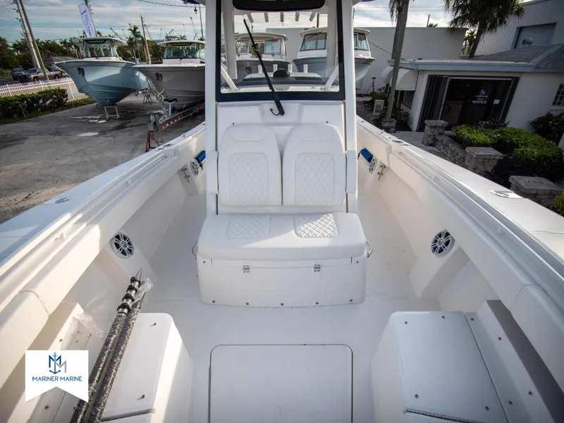 Slide: The Image of 2024 Regulator 31 boat interior with seating and storage compartments. - 17