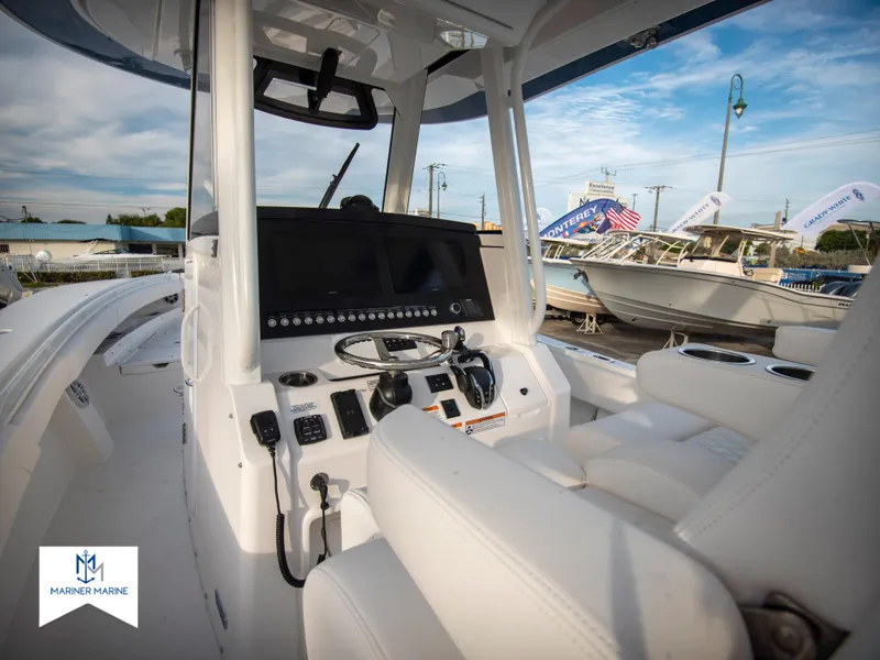 Slide: The Image of 2024 Regulator 31 boat interior with modern dashboard and seating. - 21