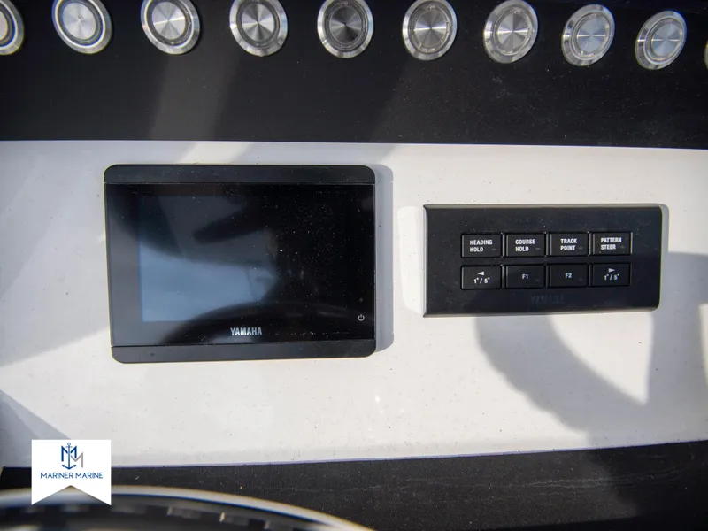 Slide: The Image of Control panel of a 2024 Regulator 31 boat with Yamaha display and buttons. - 27