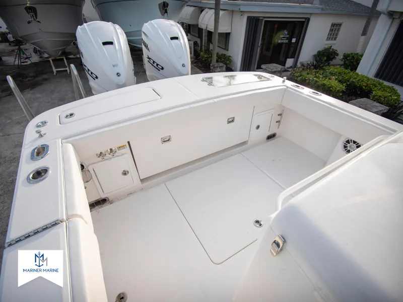Slide: The Image of 2024 Regulator 31 boat deck with twin outboard engines. - 32
