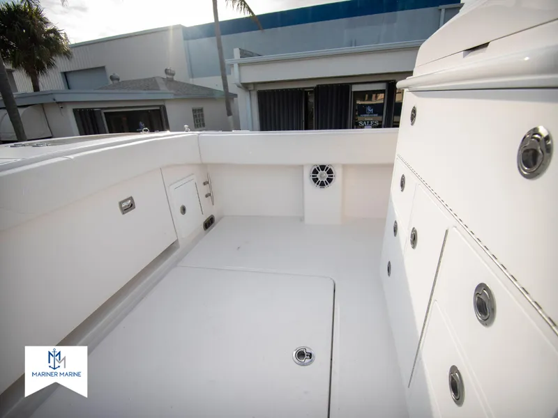 Slide: The Image of 2024 Regulator 31 boat deck with storage compartments and speaker. - 33