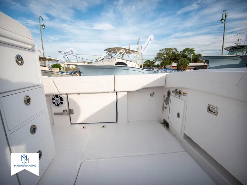 Slide: The Image of 2024 Regulator 31 boat deck with storage compartments and seating. - 36