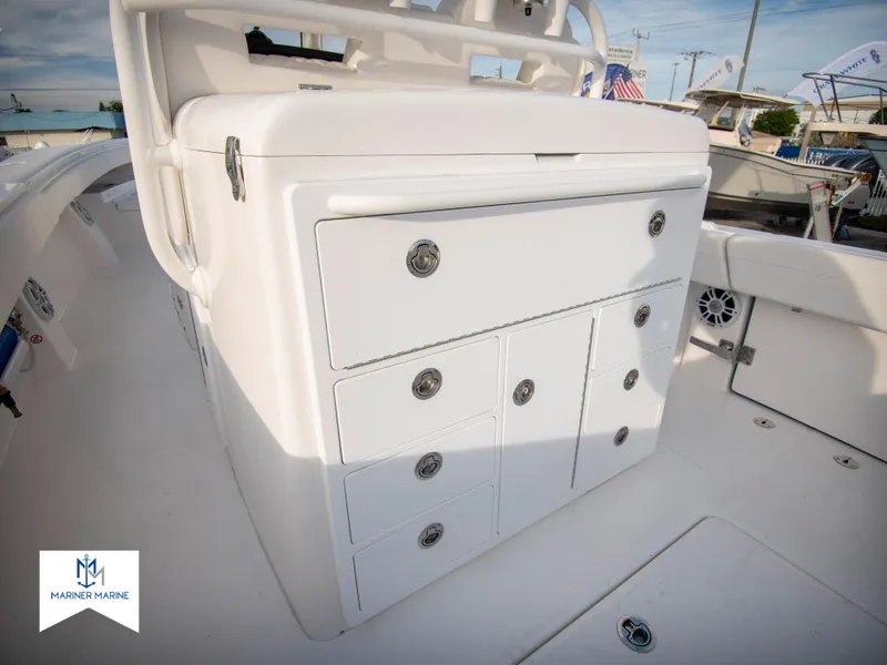 Slide: The Image of 2024 Regulator 31 boat storage compartments and seating area. - 38