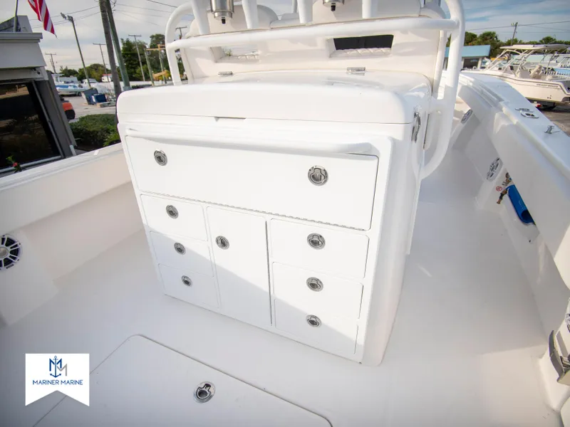 Slide: The Image of 2024 Regulator 31 boat with storage compartments on deck. - 39