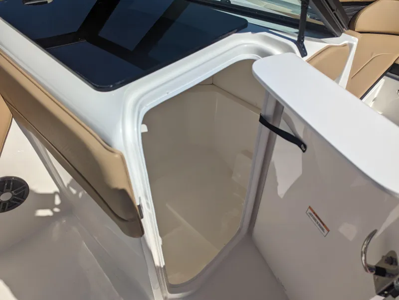 Slide: The Image of 2024 Sea Ray SPX 230 boat storage compartment with open hatch. - 11