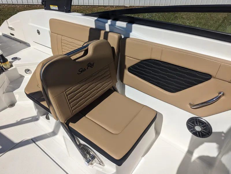 Slide: The Image of 2024 Sea Ray SPX 230 boat interior with tan and black seating. - 16
