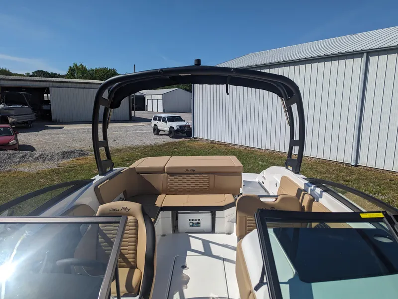Slide: The Image of 2024 Sea Ray SPX 230 boat interior with tan seating and black arch. - 19