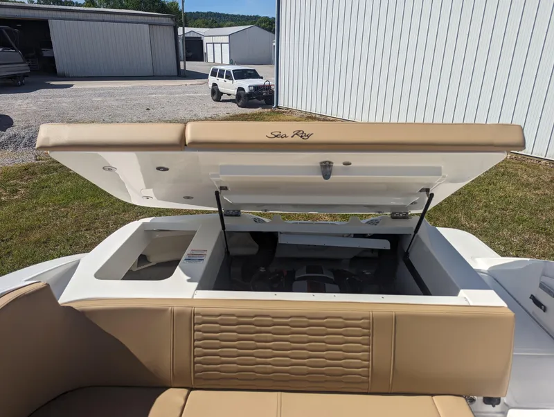 Slide: The Image of 2024 Sea Ray SPX 230 boat with open engine compartment. - 21