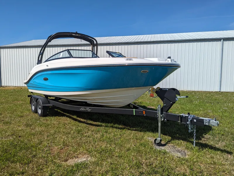 Slide: The Image of 2024 Sea Ray SPX 230 boat on trailer, blue and white hull. - 4