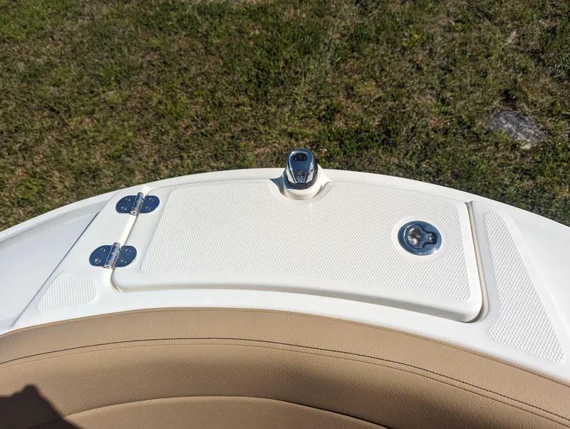 Slide: The Image of 2024 Sea Ray SPX 230 boat deck with storage compartment and latch. - 8