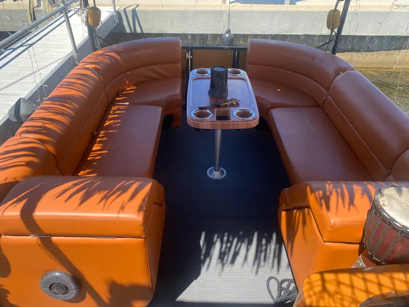 Slide: The Image of Luxurious seating area on the 2024 Custom Tiki Bahama Mama 1.0 boat. - 5