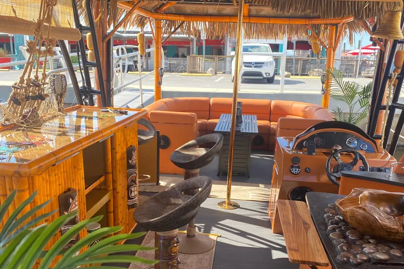 Slide: The Image of Interior of 2024 Custom Tiki Bahama Mama 2.0 with bamboo bar and tropical decor. - 3