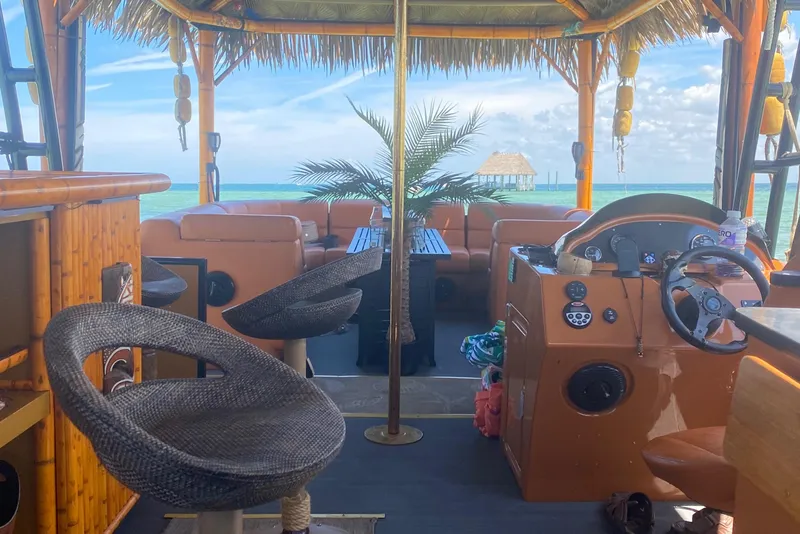 Slide: The Image of Interior of 2024 Custom Tiki Bahama Mama 2.0 boat with ocean view. - 4