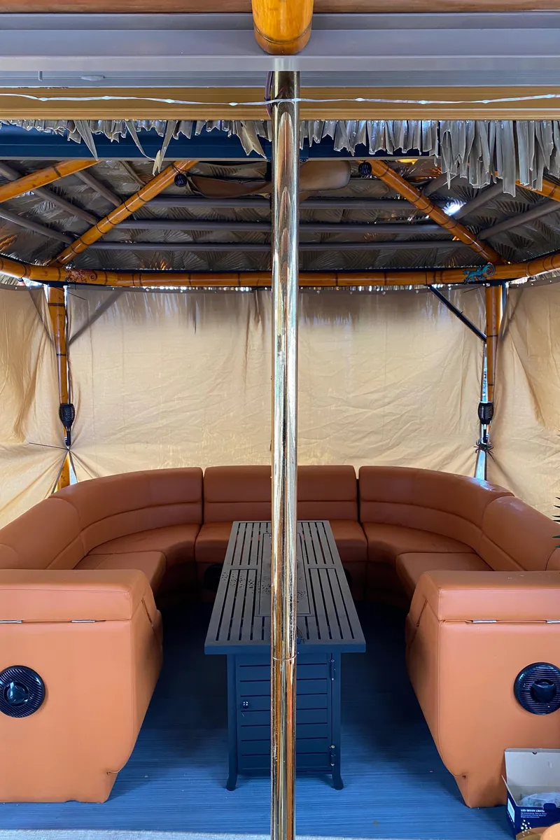 Slide: The Image of Custom Tiki Bahama Mama 2.0, 2024 model, featuring a cozy outdoor seating area with a central table. - 7