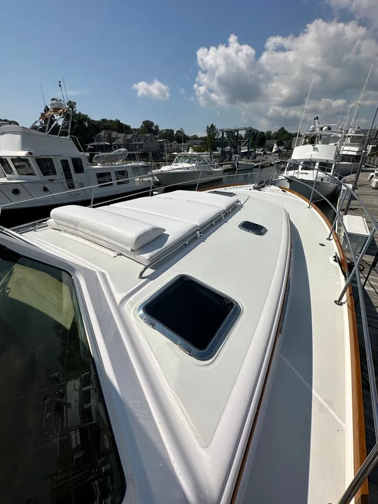 Slide: The Image of 2012 Sabre 48 Salon Express yacht docked at a marina on a sunny day. - 37