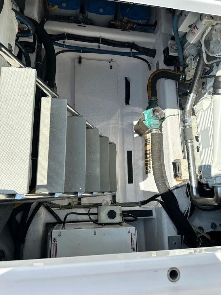 Slide: The Image of Engine room of a 2012 Sabre 48 Salon Express yacht with visible machinery. - 39