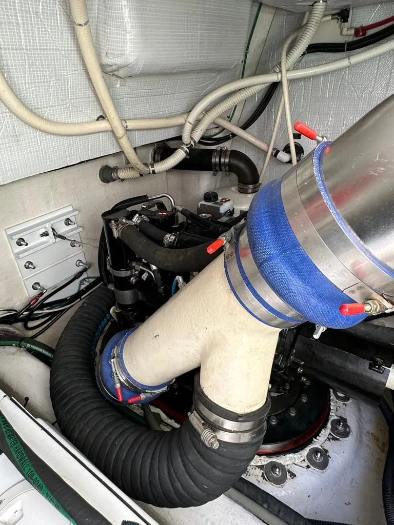 Slide: The Image of Engine room of a 2012 Sabre 48 Salon Express yacht showing exhaust and wiring. - 42