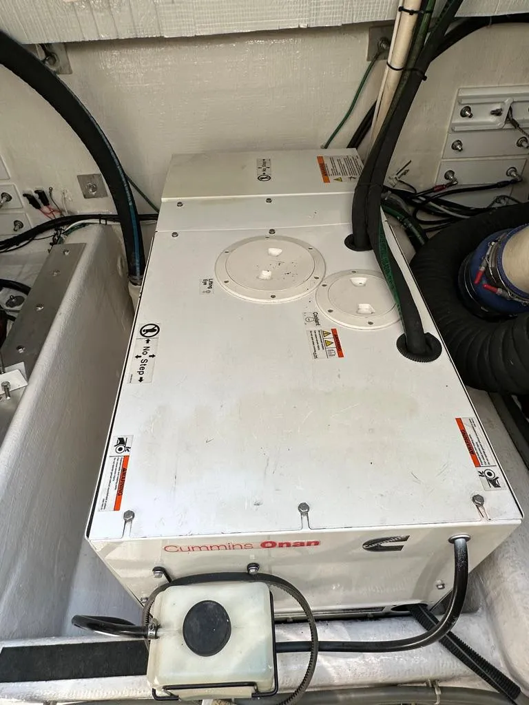 Slide: The Image of Cummins Onan generator in the engine room of a 2012 Sabre 48 Salon Express yacht. - 43