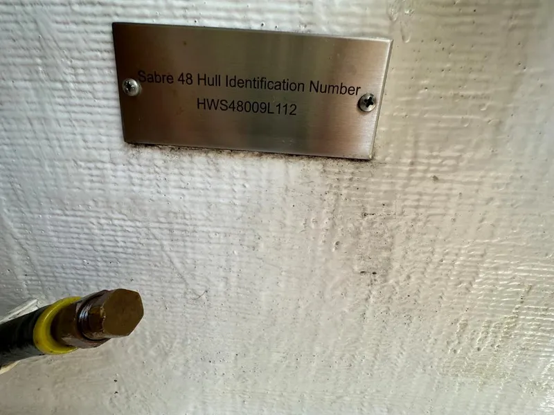 Slide: The Image of Hull identification number plate on 2012 Sabre 48 Salon Express boat. - 49