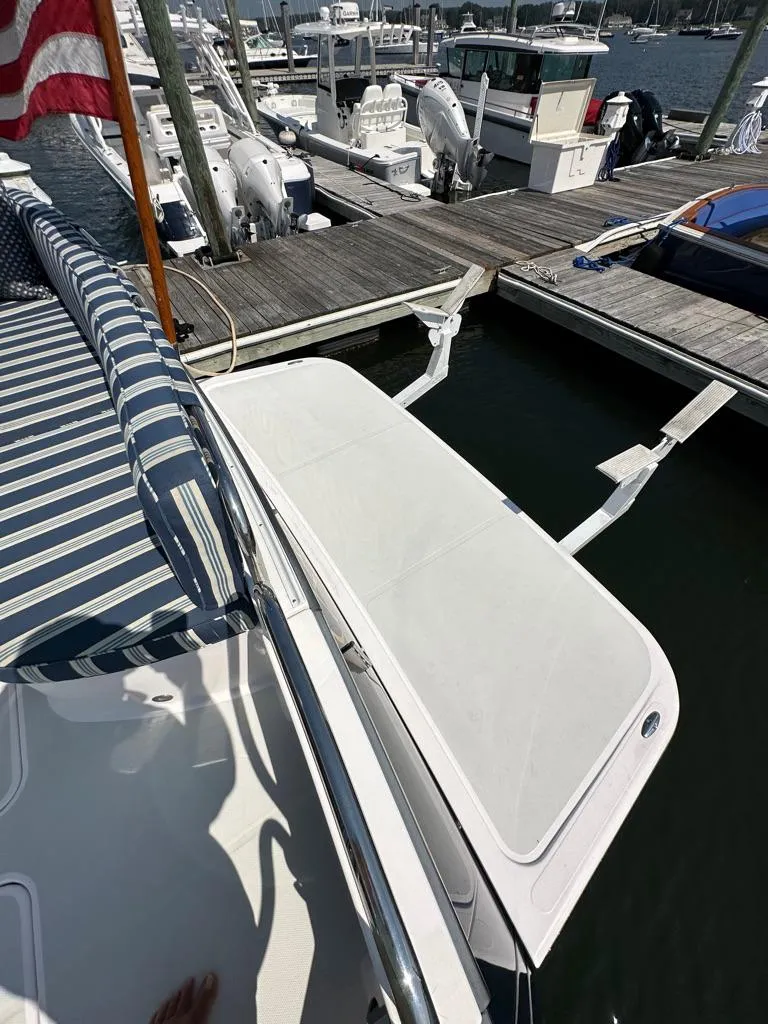 Slide: The Image of Sabre 48 Salon Express 2012 yacht docked at marina with swim platform. - 5