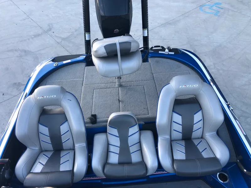 Slide: The Image of 2019 Nitro Z18 boat interior with three cushioned seats. - 10