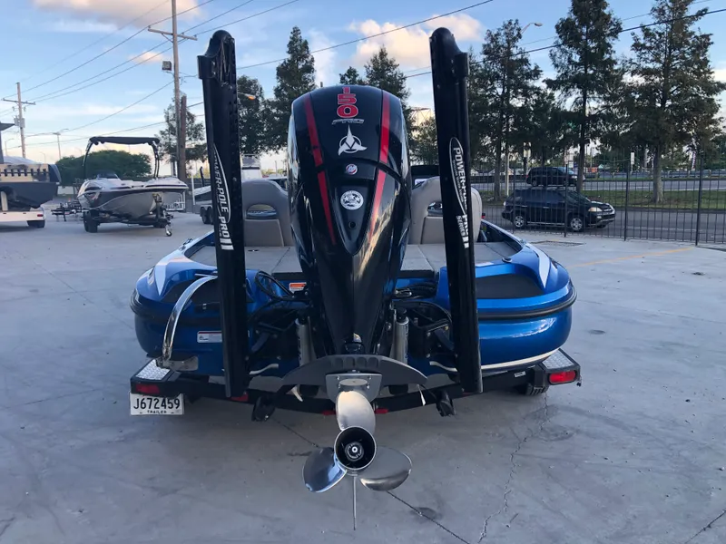 Slide: The Image of 2019 Nitro Z18 boat with outboard motor in a parking lot. - 5