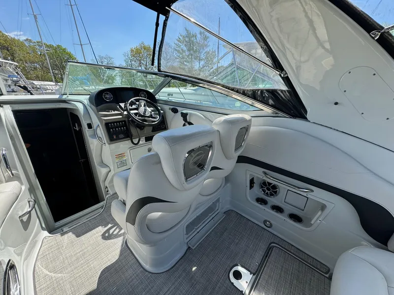 Slide: The Image of 2020 Crownline 264CR boat interior with modern helm and seating. - 26