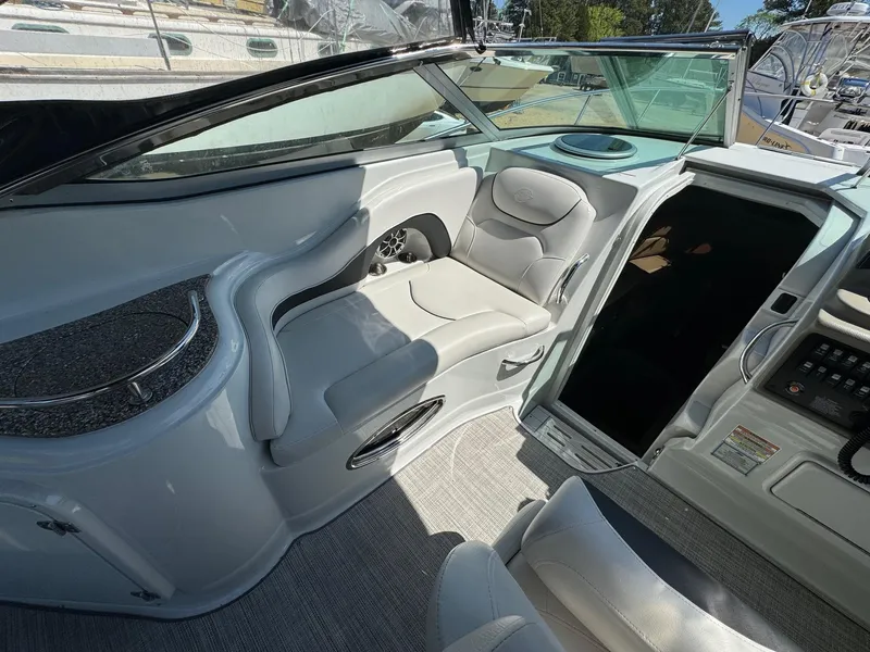 Slide: The Image of 2020 Crownline 264CR boat interior with plush seating and modern design. - 29
