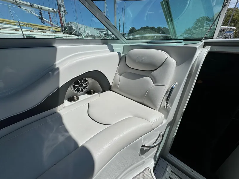 Slide: The Image of Crownline 264CR 2020 boat interior with cushioned seating and speaker. - 32