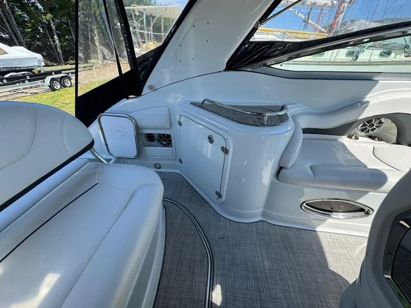 Slide: The Image of 2020 Crownline 264CR boat interior with white seating and modern design. - 33