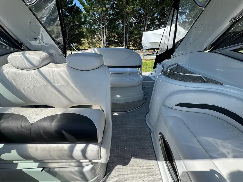 Slide: The Image of 2020 Crownline 264CR boat interior with white leather seating and modern design. - 35