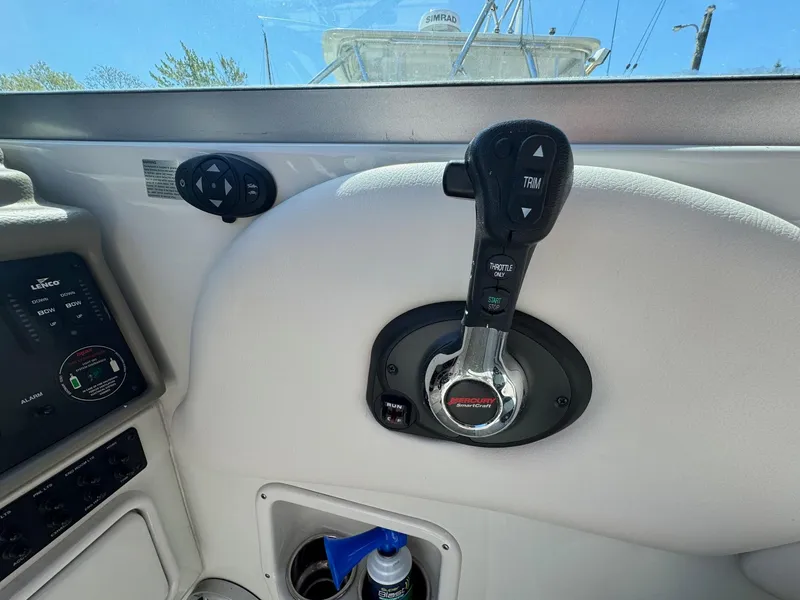 Slide: The Image of 2020 Crownline 264CR boat throttle control and dashboard details. - 40