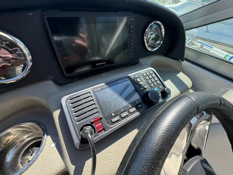 Slide: The Image of Crownline 264CR 2020 dashboard with Garmin display and control panel. - 43