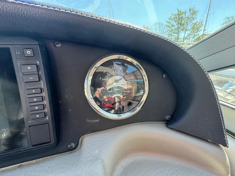 Slide: The Image of Dashboard of 2020 Crownline 264CR boat with RPM gauge and control panel. - 45