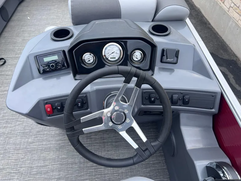 Slide: The Image of 2024 Bennington 22SV boat dashboard with steering wheel and control panel. - 5
