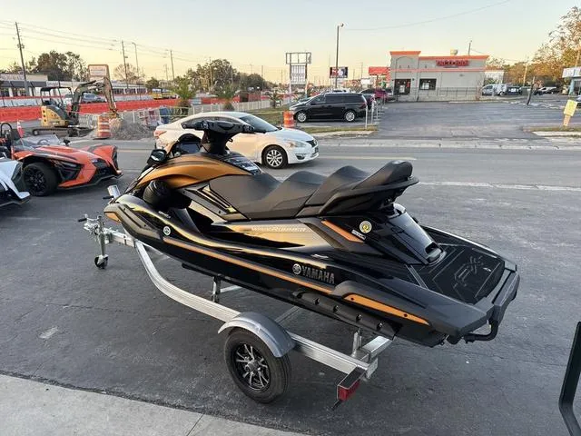 Slide: The Image of 2024 Yamaha Marine Waverunner FX LIMITED SVHO in black, rear seat view with tow rope. - 11