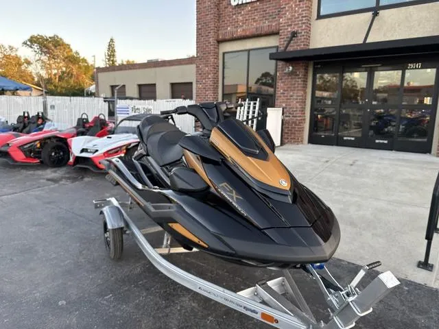 Slide: The Image of 2024 Yamaha Marine Waverunner FX LIMITED SVHO dashboard with digital display, black and copper design. - 4