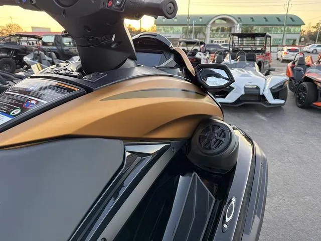 Slide: The Image of 2024 Yamaha Marine Waverunner FX LIMITED SVHO with open storage compartment, black and copper design. - 7