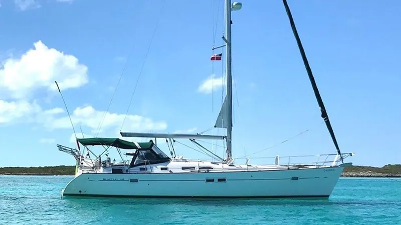 Slide: The Image of 2005 Beneteau 423 sailboat on turquoise water under a clear blue sky. - 0