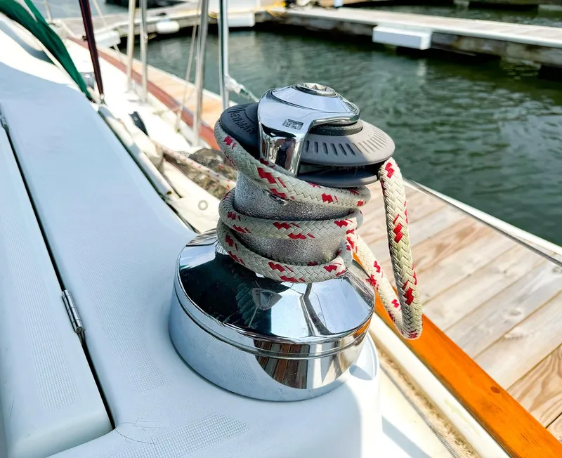 Slide: The Image of Winch with rope on 2005 Beneteau 423 sailboat, docked by the water. - 11