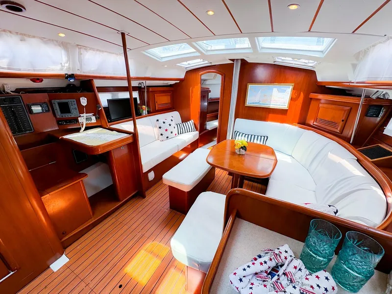Slide: The Image of Luxurious interior of 2005 Beneteau 423 yacht with elegant wood finish and spacious seating. - 13